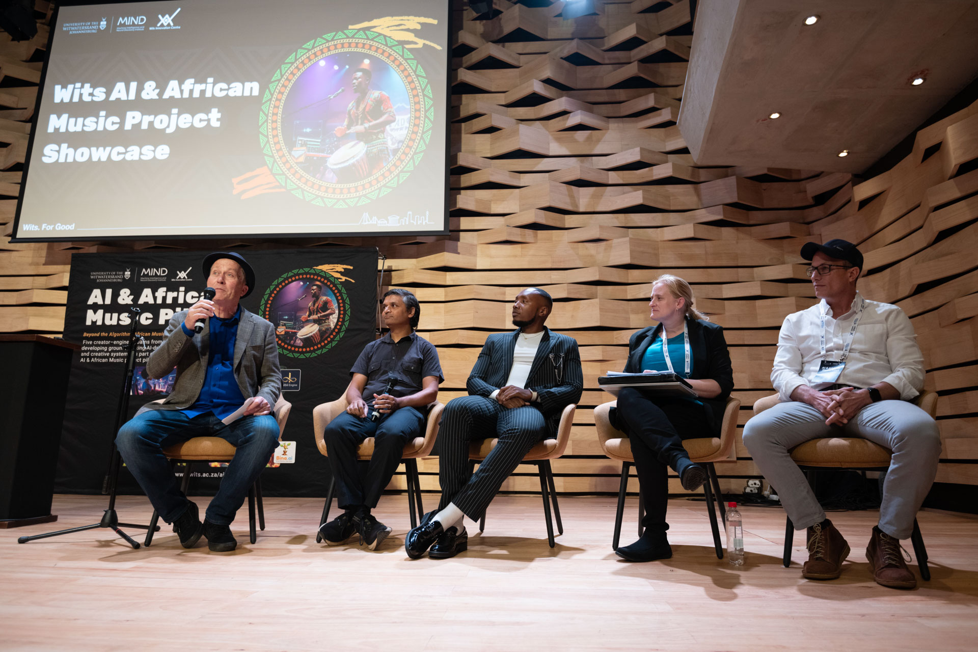 Wits AI & African Music Project Showcase panel, Gift Lubele at centre. Photograph.